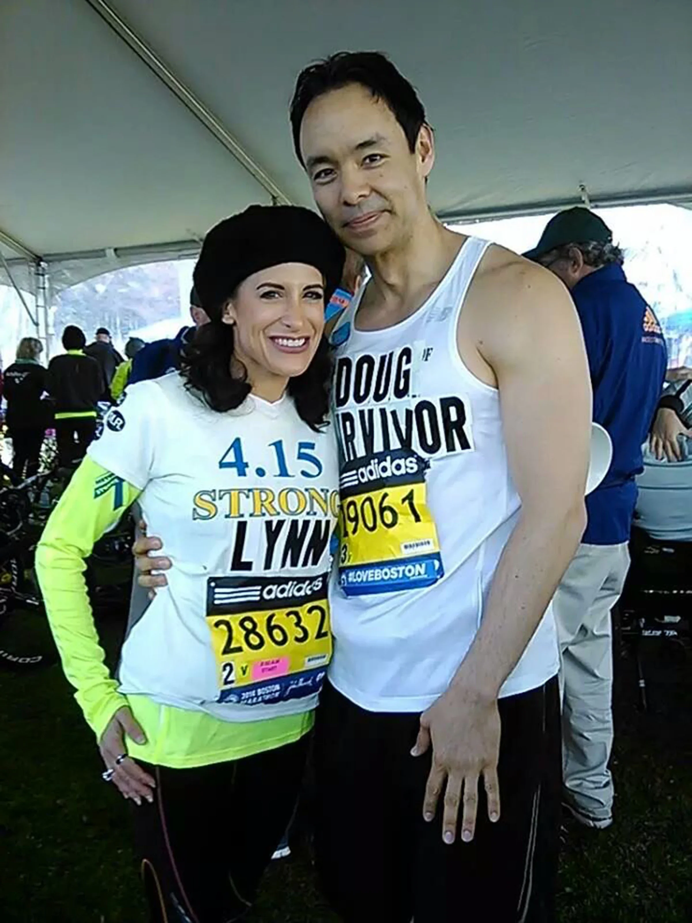 Alt text: Lynn Julian is pictured with a fellow Boston Marathon bombing survivor in 2014, the year after the bombing.