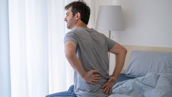 Sleep: Lower back pain: man backpain bed 1337767747