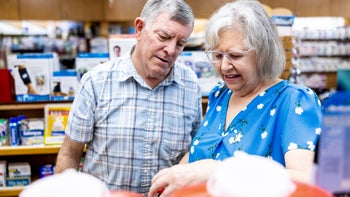 Urology: senior couple at phamarcy 1974036078