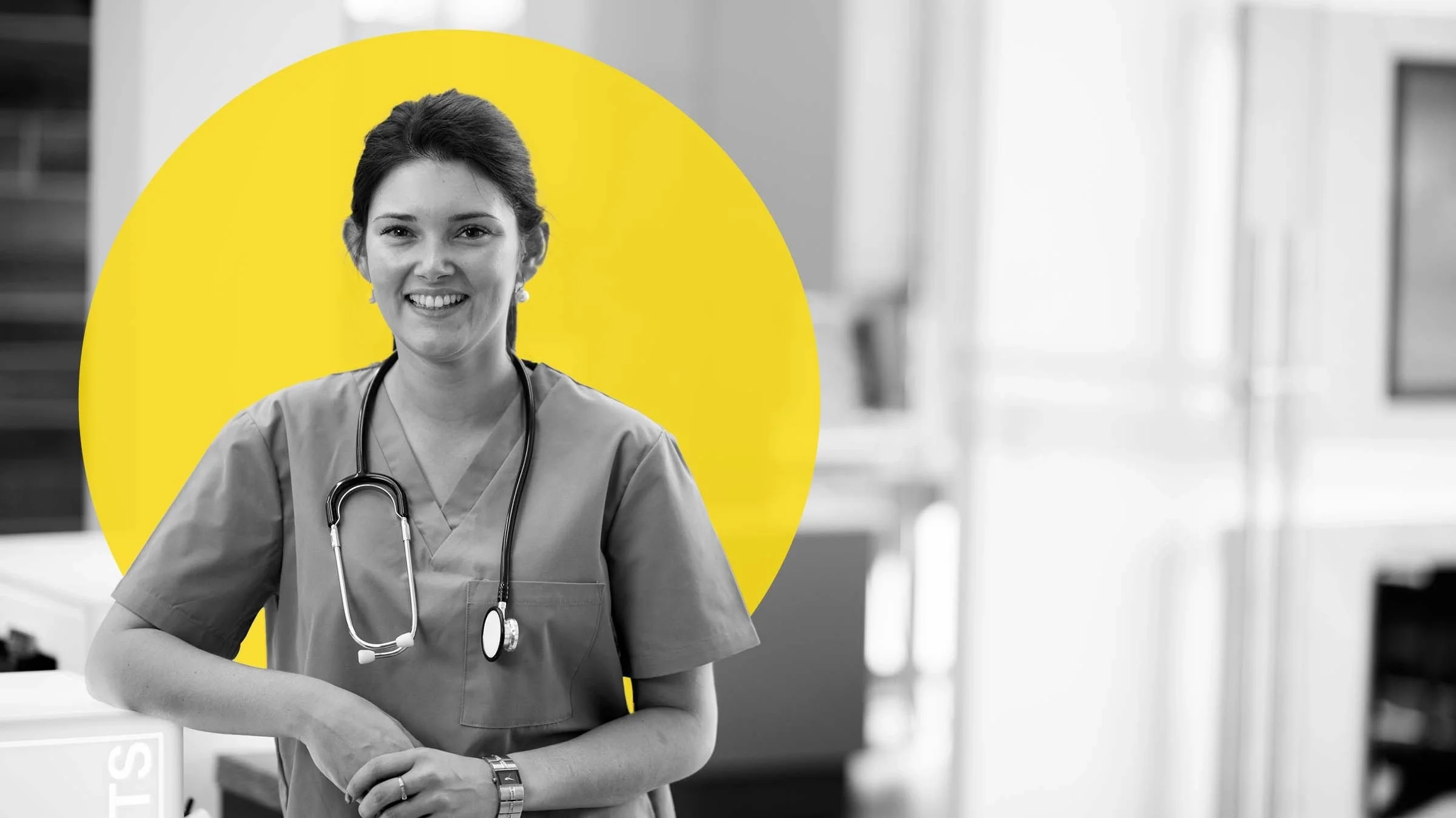 Black and white portrait of a nurse or PA in the hospital. There is an added graphic yellow circled behind her head.