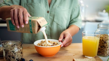 diet-nutrition: closeup pouring milk into bowl 1493710136
