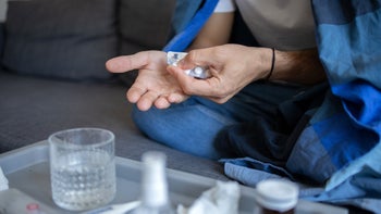 Health: Xofluza: closeup man with the flu takes medication 1433359298