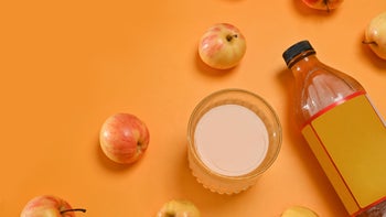 Gut-health: apple cider vinegar on orange background 1774577768