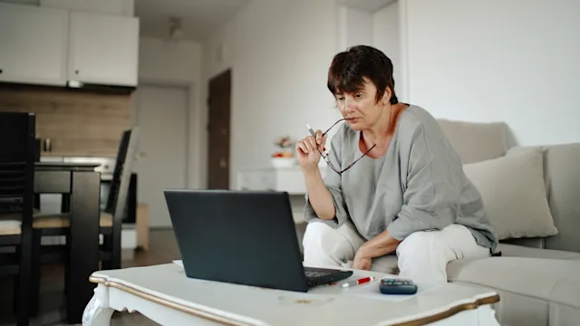 Medical debt: Remove: doing finances holding glasses 1424823220