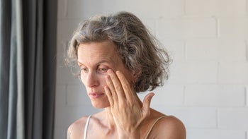 menopause: eye: vision: older woman eye pain 1132208914