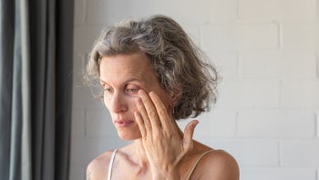 menopause: eye: vision: older woman eye pain-1132208914