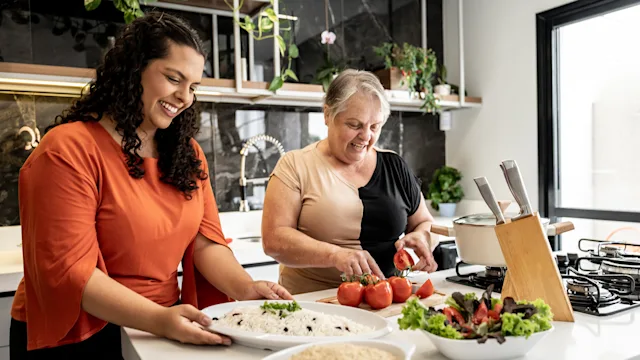 Diet and Nutrition: mother daughter preparing a meal 1841188667