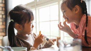 Food Poisoning: Children's Health: Nutrition: two young girls eating-1389708060