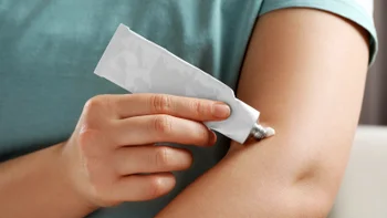 Dermatology: closeup ointment on arm 1678838850