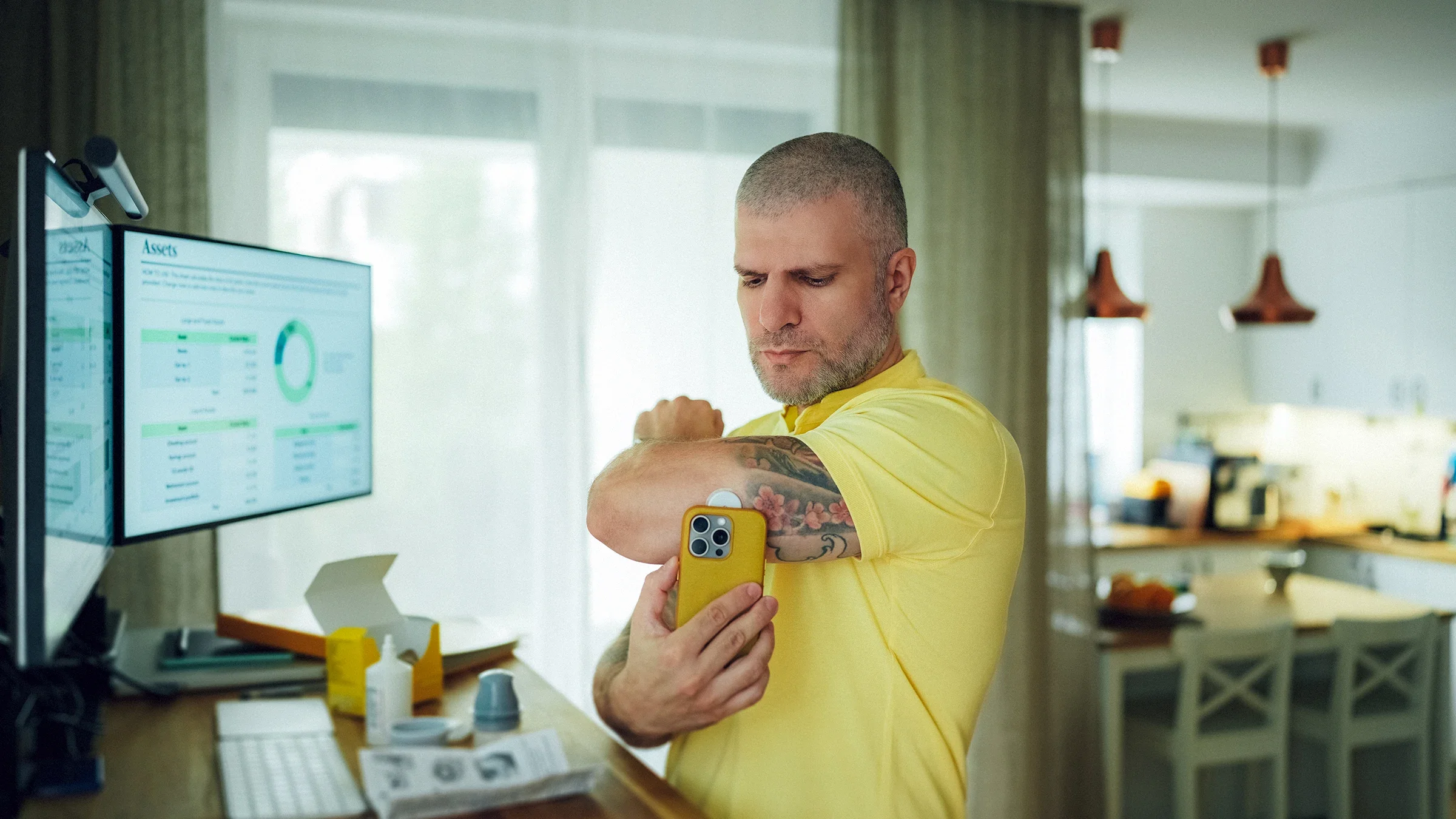 Adult measuring glucose levels with phone application.
martin-dm/E+ via Getty Images