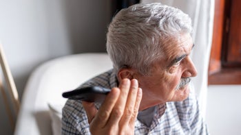 COVID: senior man using smartphone 1499161859