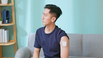 Smoking cessation: man wearing nicotine patch 2186636522