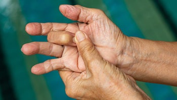 movement exercise: closeup trigger finger stretch 1159180723
