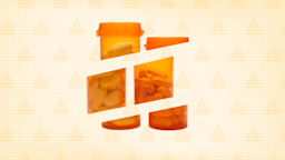 Light orange-yellow background with a half-tone pattern and warning icon pattern. There are two orange bottles of pills in the center cut apart into sections.
GoodRx Health