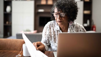 Health: Caregiving: woman doing finances 1304359930
