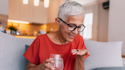 Woman taking pills
ljubaphoto/Getty Images