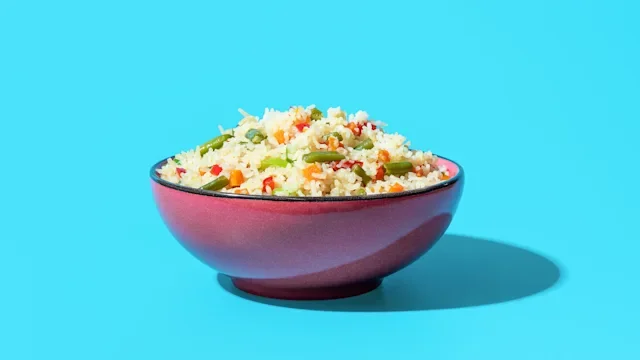 diet-nutrition: bowl of rice on blue background 1500763900