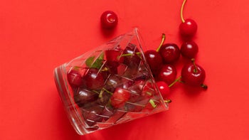 sleep: cherries in glass on red background 1460164146