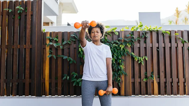 Hypertension: woman weight training at home 1324558955