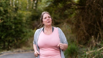 Health: Hemorrhoids: woman walking outdoors 1332401228