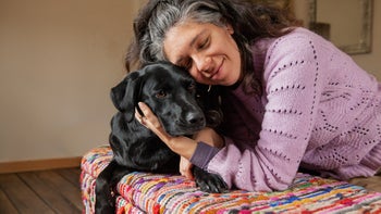 dog: woman hugging her dog 1986266783
