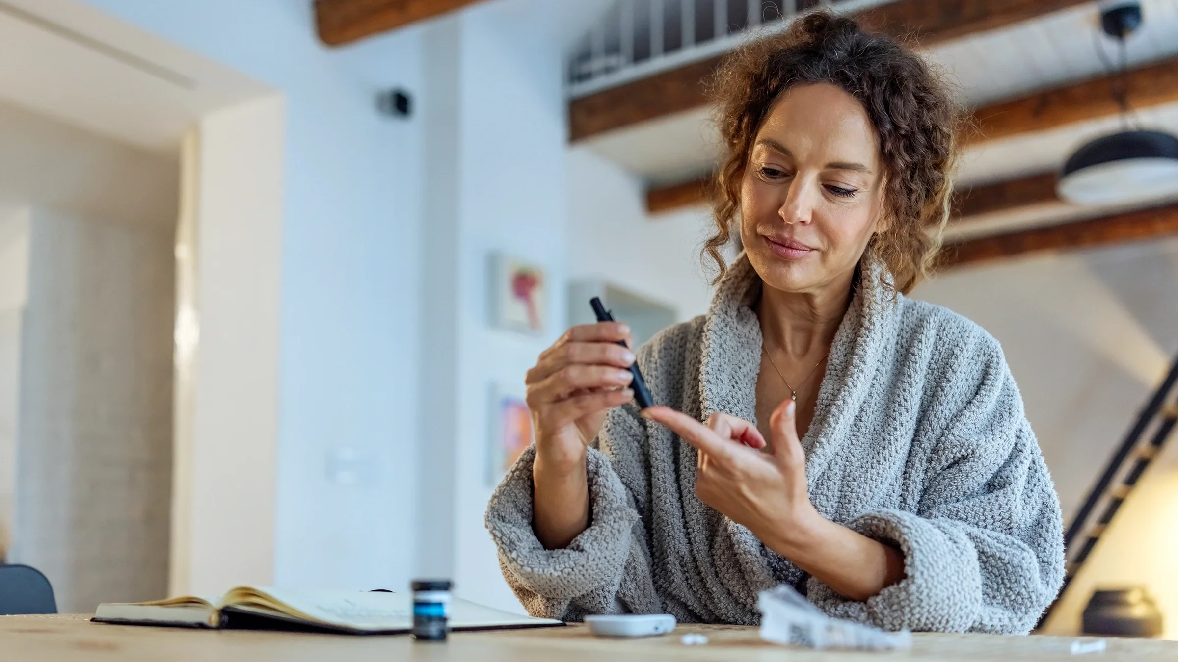 A woman checks her blood sugar level.