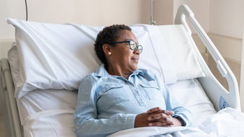 medical-supplies-and-devices: patient: woman in hospital bed at home-1059416518