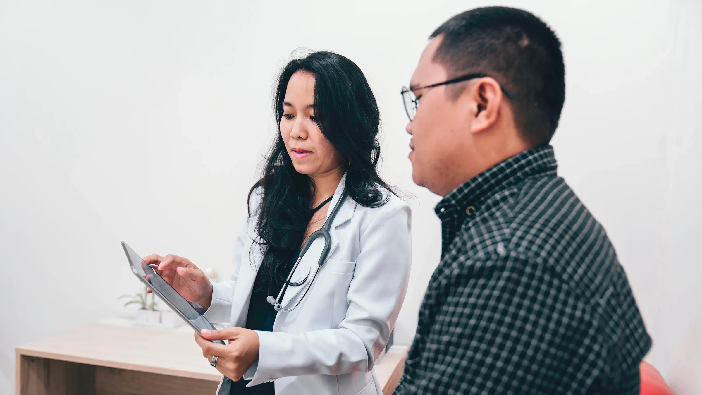 Doctor discussing medical plan with a patient.
rudi_suardi/E+ via Getty Images