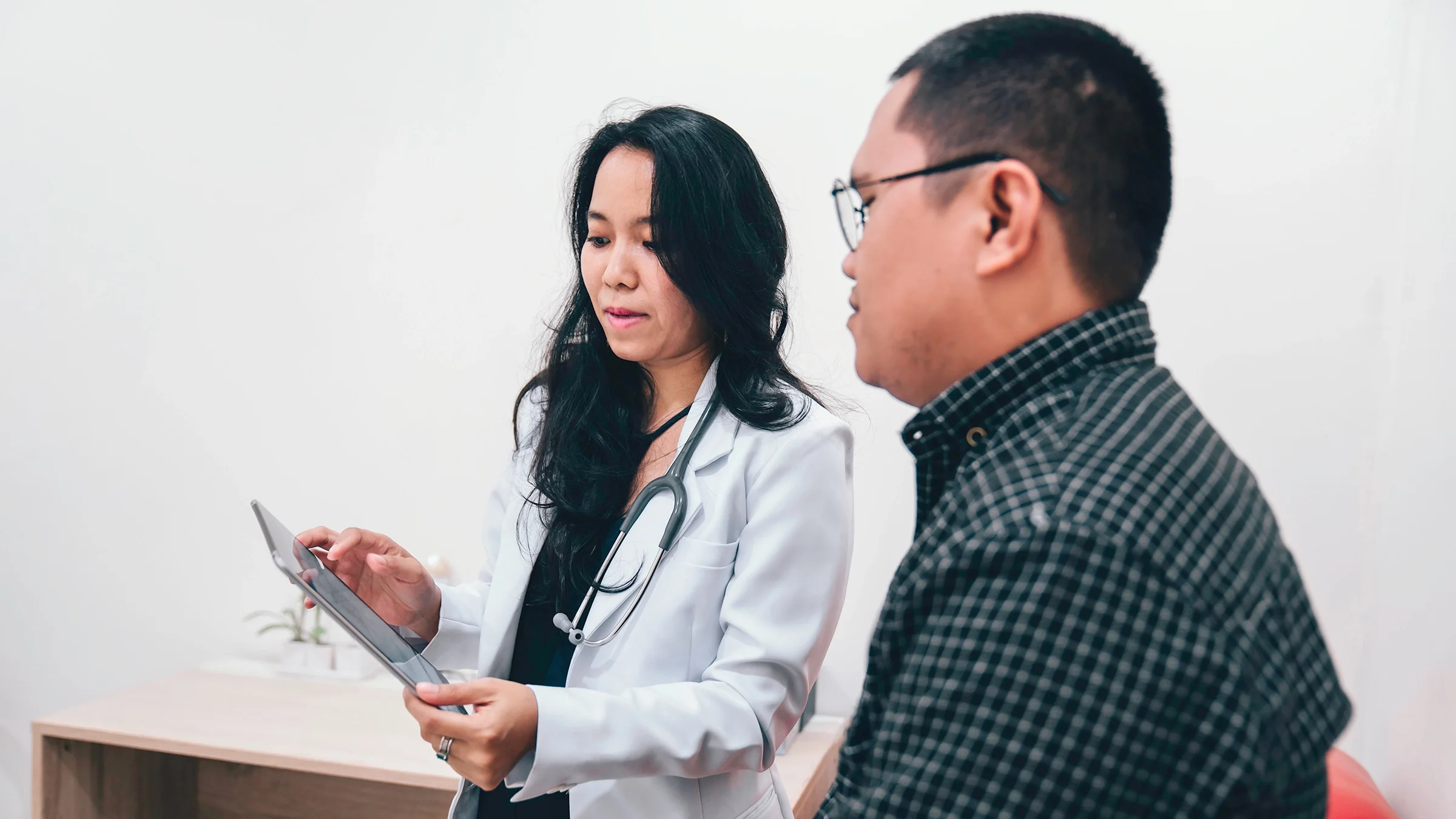 Doctor discussing medical plan with a patient.