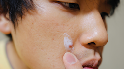 Close-up of a person applying cream on a pimple.
Yusuke Ide/iStock via Getty Images Plus  