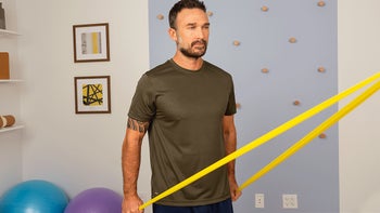 man doing shoulder extension with resistence band HERO 2400