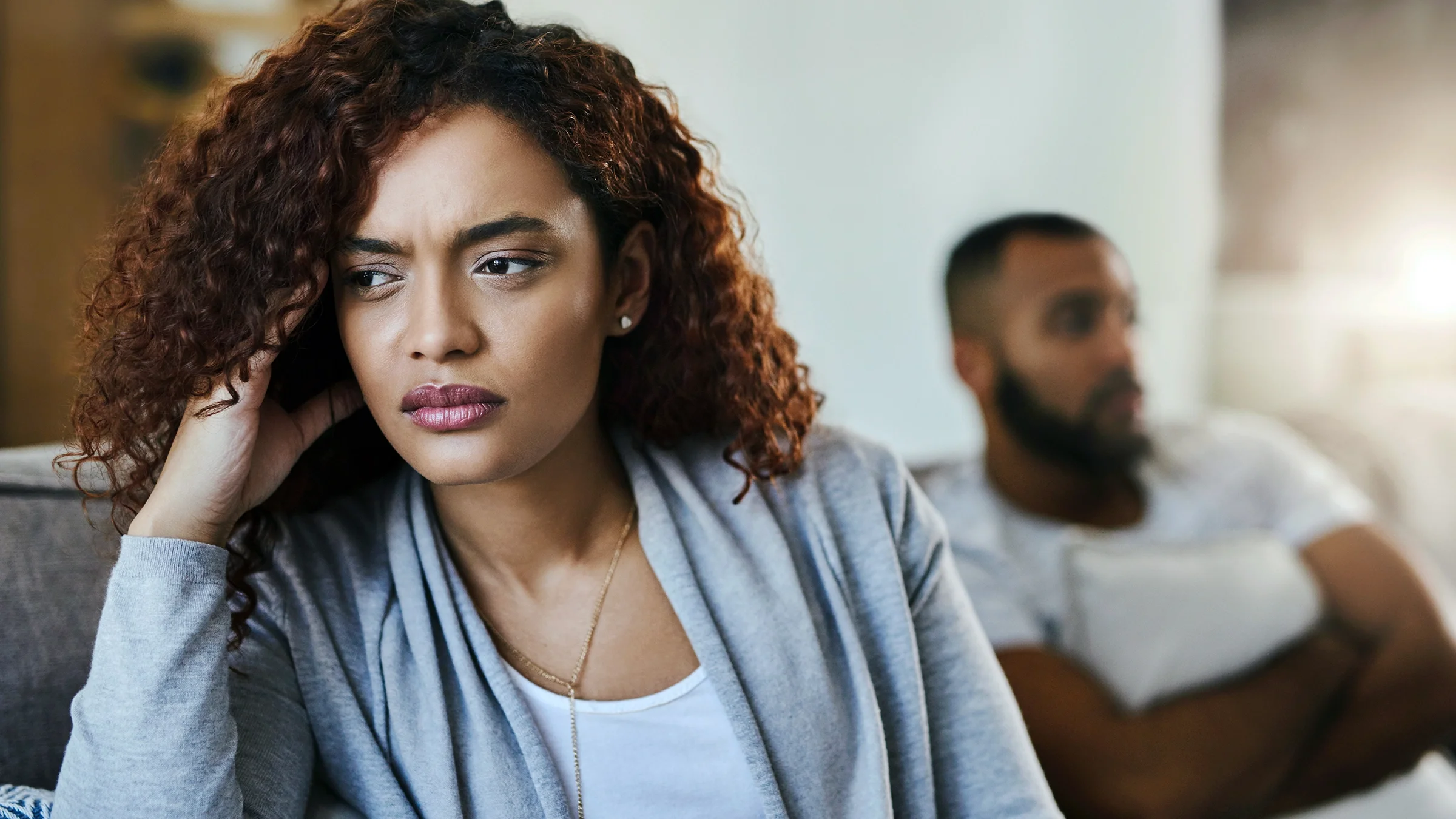 Woman looking upset after having an argument.