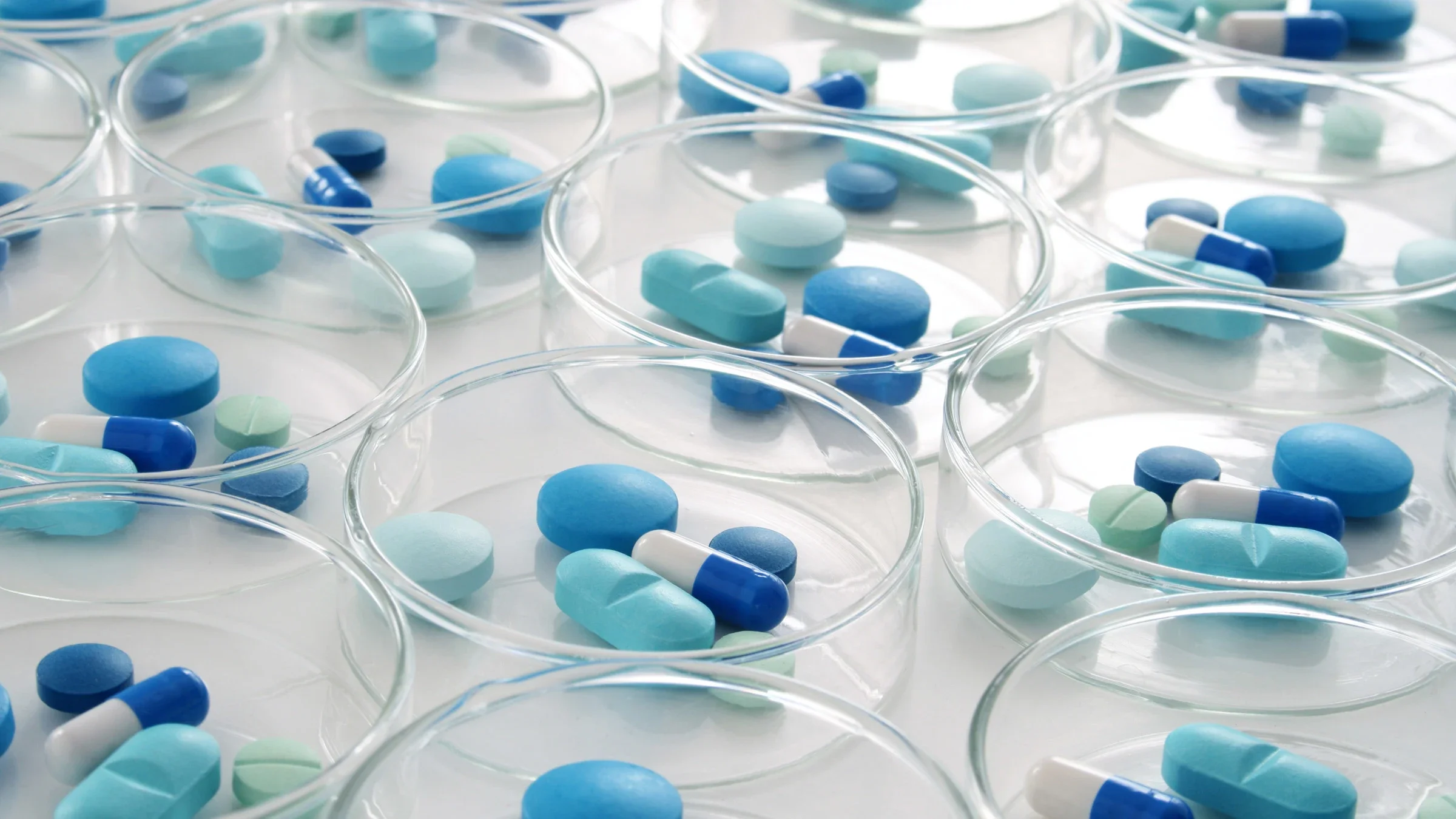 A variety of blue pills in petri dishes.
FotografiaBasica/E+ via Getty Images 