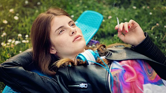 Substance use: teen smoking weed skateboard 676905492