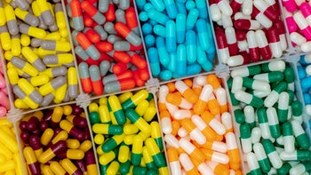 various two color pills organized in boxes-1272719811