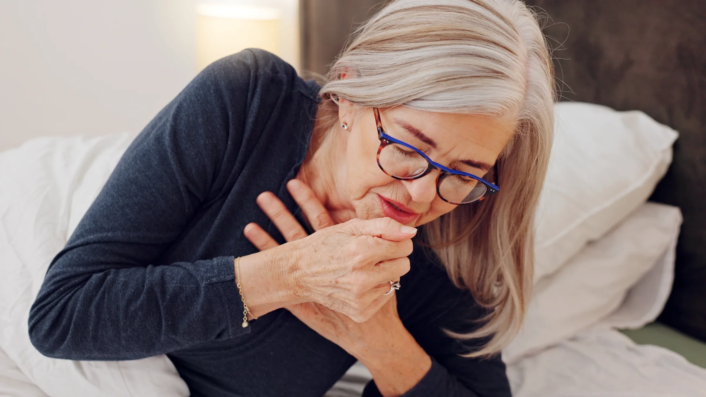 Woman coughing.