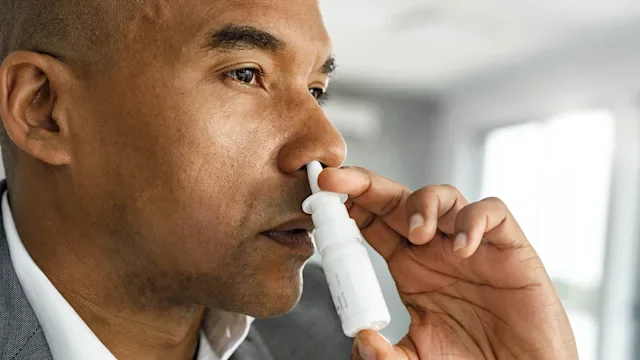 nasalcrom: man using nasal spray 1254013334