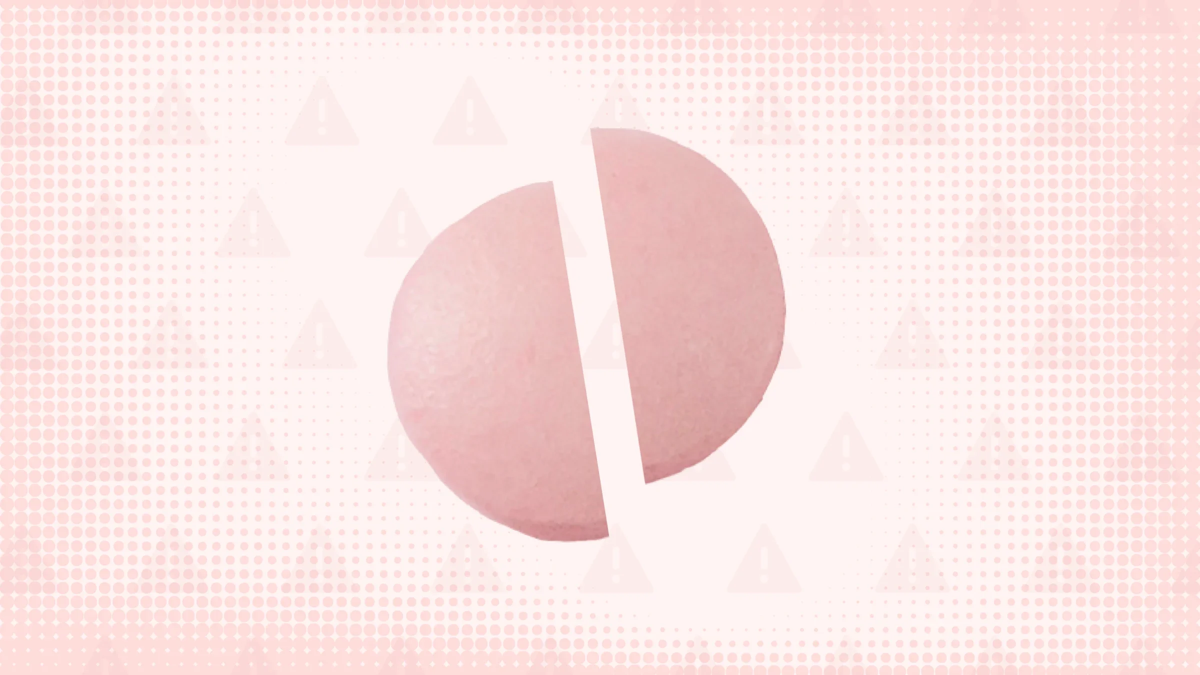 Pink background with texture and warning sign pattern. In the center is a round pink pill cut in half.
GoodRx Health