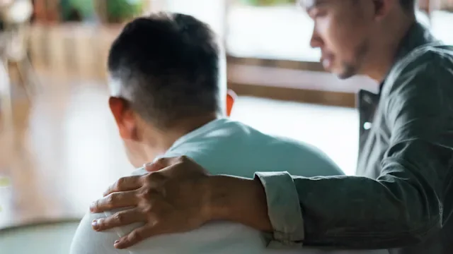 Health: Substance use: family support arm around shoulder 1349214017