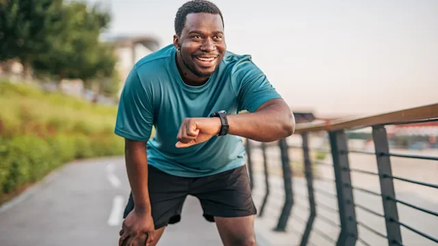 Wegovy: man checking smart watch 2231079370