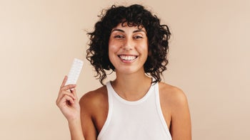 Health: birth control: portrait with birth control smiling-1392524651