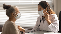 Senior patient at check-up with doctor. They are listing to her heart beat with a stethoscope.
fizkes/iStock via Getty Images