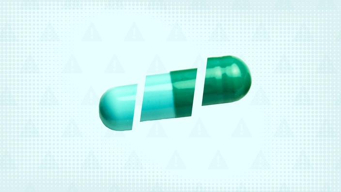 A custom graphic features a light-teal background with a warning sign pattern and a teal capsule cut into thirds.