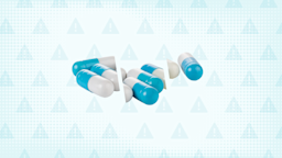 A custom graphic includes a teal background with a warning sign pattern and a pile of capsules cut into thirds.
GoodRx Health