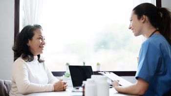 Health: Medicare: hcp talking to older patient 1467813852