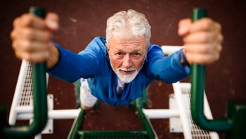 Movement-exercise: senior man doing pull up 1031518492