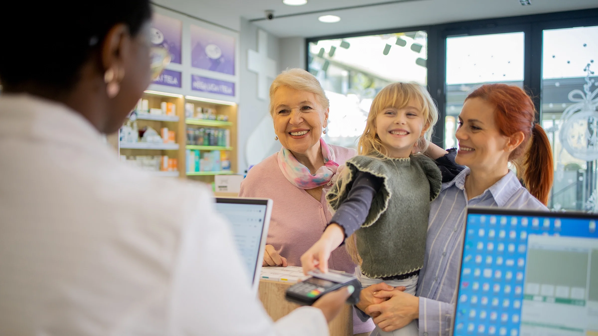 A family shops at a pharmacy.