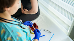 Close-up of a nurse holding a vaccine syringe.
Ugur Karakoc/E+ via Getty Images