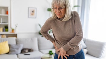 senior woman in pain 2160474952