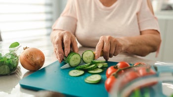 Diet and nutrition: closeup cutting cucumbers 1412478473